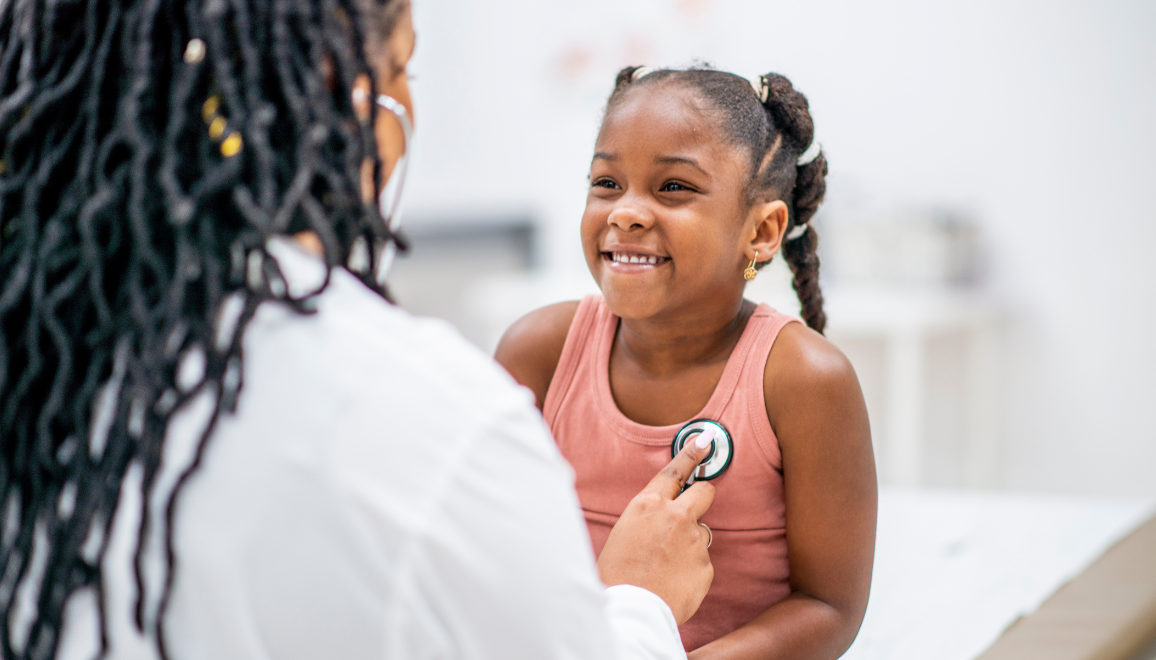 doctor examining a kid with a stethoscope